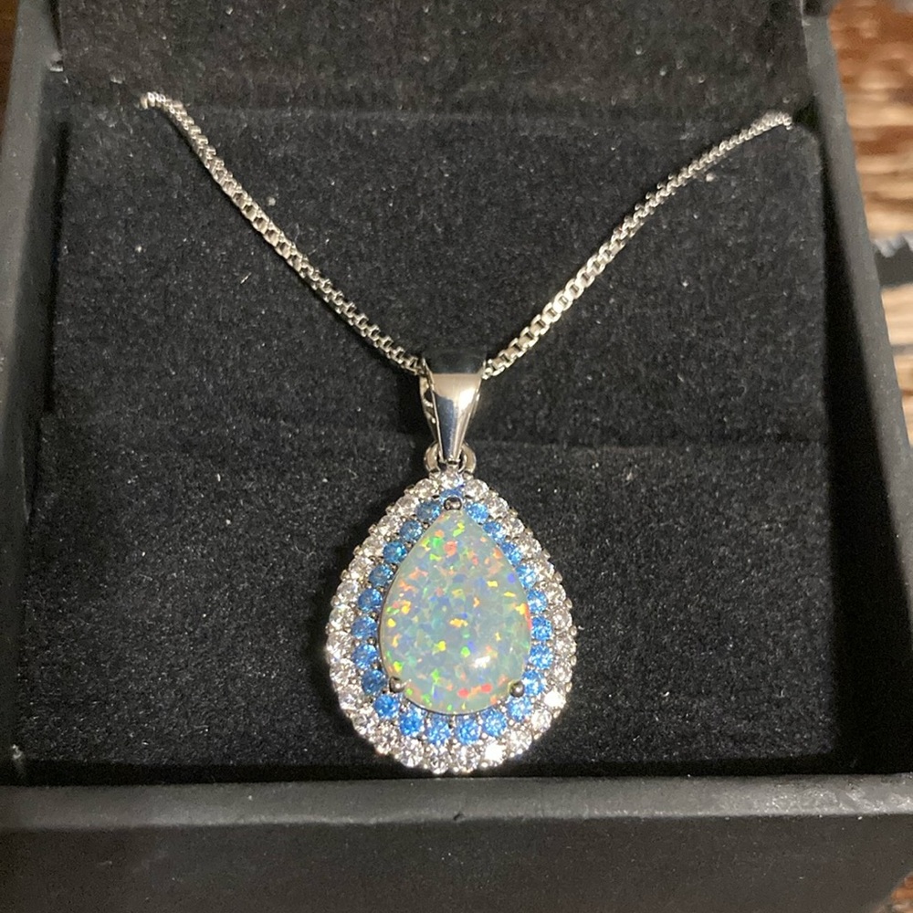 Beautiful fire Opal with light blue and clear stones stamped 925